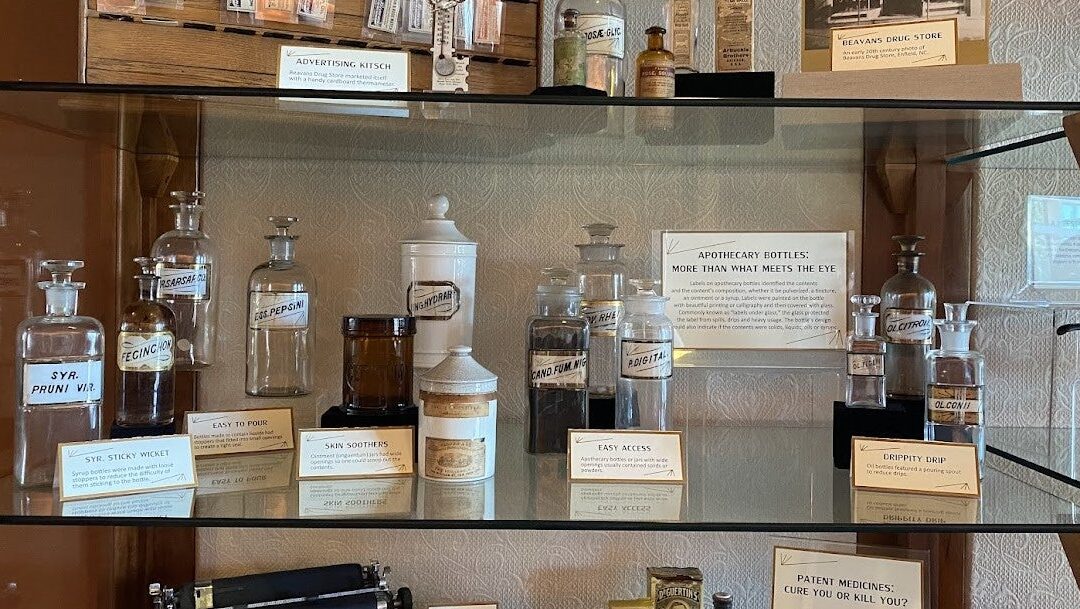 Medicine bottles in an exhibit case.