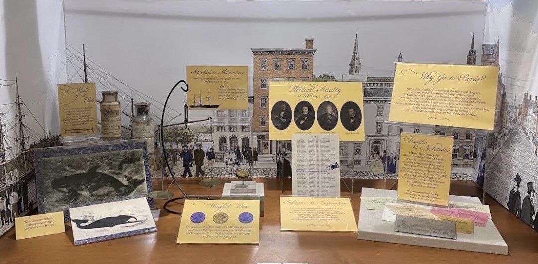 An exhibit shelf features interpretive labels and some artifacts from the mid-19th century in America.